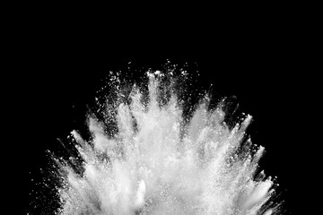 White powder explosion on black background. Colored cloud. Colorful dust explode. Paint Holi.