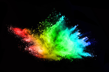 abstract colored dust explosion on a black background.abstract powder splatted background,Freeze...