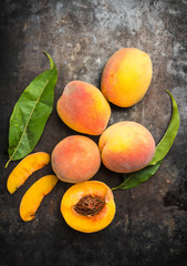 Sweet ripe peaches on the rustic background. Selective focus. Shallow depth of field.