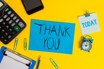 Writing note showing Thank You. Business concept for a polite expression used when acknowledging a gift or service Clipboard sheet calculator pencil clock smartphone color background