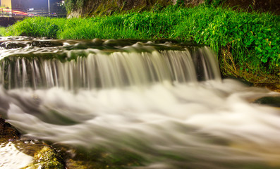 River in the night in long exposure with the green river banks