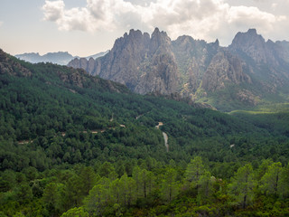 Fototapeta na wymiar Mountain landscape with the Aiguilles de Bavella in the background (Corsica - France)