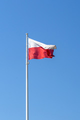 Poland national flag on blue sky background