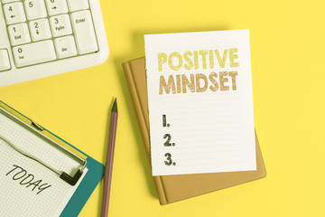 Writing note showing Positive Mindset. Business concept for mental attitude in wich you expect favorable results Pile of empty papers with copy space on the table