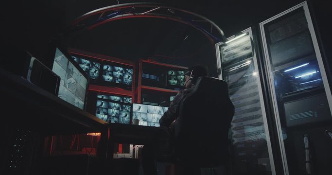 Hacker watching security camera footage