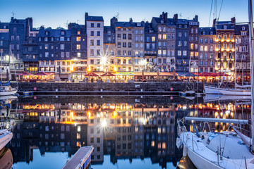 HONFLEUR, FRANCE - MAY4, 2018:Waterfront reflection of traditional houses in Honfleur, Normandy, France
