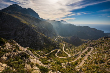 Wide view of Coll dels Reis road with mountains