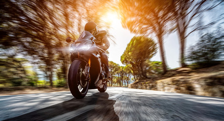 motorbike on the road riding. having fun driving the empty highway on a motorcycle tour journey