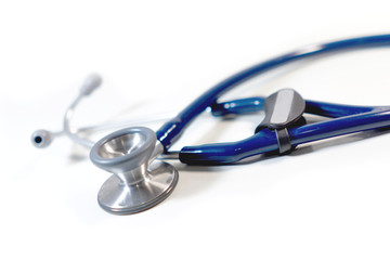 selective focus of stethoscope on white background