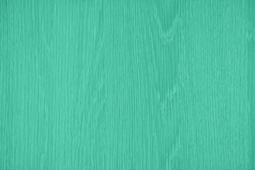 Trendy mint toned, low contrast wood texture background. Wavy textured plywood, a lot of fiber and small chips, close-up abstract tree background for design, decor and skins