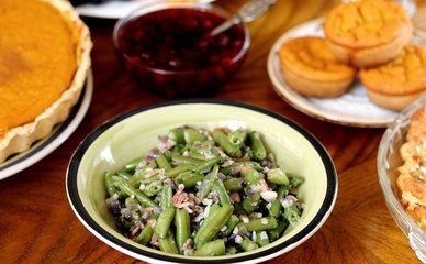 green beans with bacon and garlic. a traditional dish for Thanksgiving. refreshments on the festive table. celebration of the harvest day