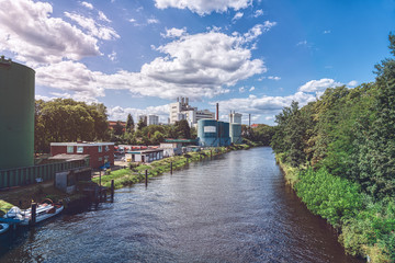 Berlin canal in summer with industrial plants
