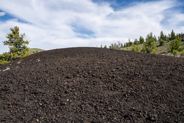 Hill of black volcanic rock at Crateres of the Moon National Monument in Idaho