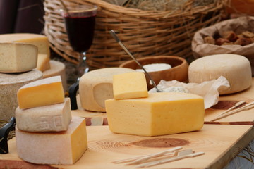 various types of cheese on wooden table