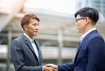 Midsection Of Businessmen Shaking Hands