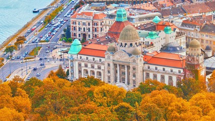 BUDAPEST, HUNGARY - OCTOBER 3, 2018: The famous Gellert Hotel Palace facade and entrance with Gellert Baths thermal spa at Gellert hill in Budapest, popular Europe travel destination. Aerial fall view