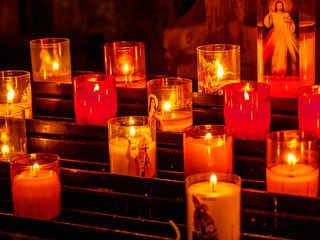 Lit prayer candles at a church