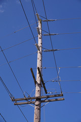 Classic wooden pole with electrical installations. USA.