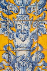 Fototapeta na wymiar background with a fragment of ceramic tiles in yellow and blue from Talavera de la Reina, in Spain.