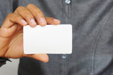 People holding a business card