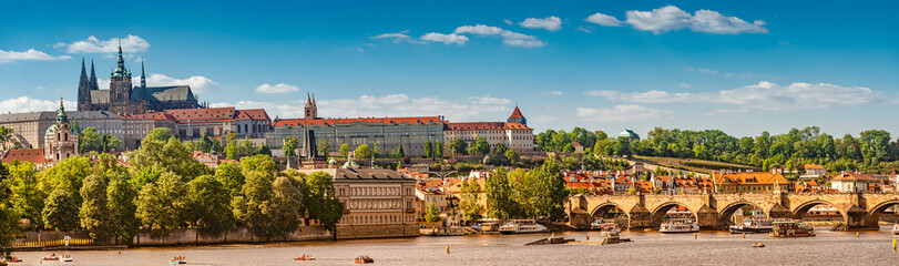 Fototapeta na wymiar Panoramic view of magnificent Saint Vitus Cathedral and Charles Bridge in Prague, Czech Republic