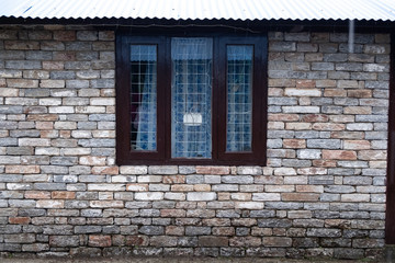 Modern window with skyscraper view in brick wall