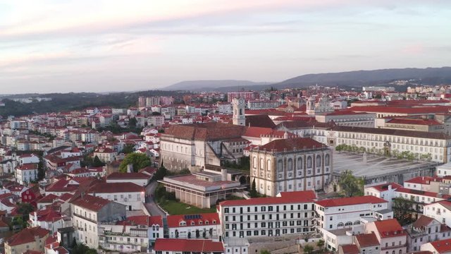 Aerial drone view of Coimbra city and Mondego river at sunset