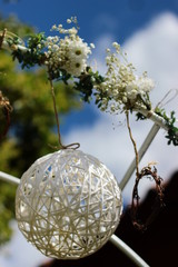 Decoration ball. White wedding decoration in the shape of a ball. Wedding in nature, photo background