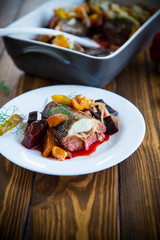 fish stew with beets and other vegetables in a plate