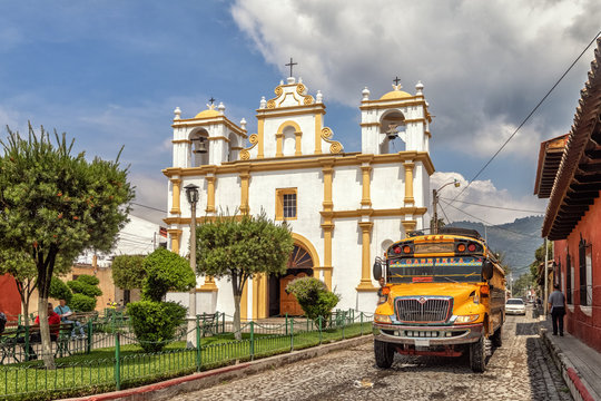 Chicken bus in front of Ermita de Santa Lucia, Antigua Guatemala, Guatemala