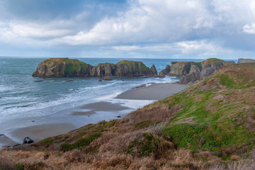 High angle landscape in Bandon, Oregon of large stone formations at the ocean edge