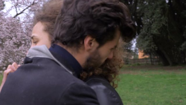 Desperation,miscarriage,sadness.Depressed crying couple hugging in the park