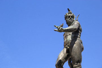 Fototapeta na wymiar Neptune with his trident, Bologna, Italy.