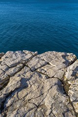 Rocky canyon beach with blue sea