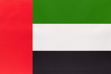 UAE national fabric flag, textile background. United Arab Emirates state official sign.