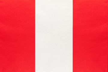Obraz premium Peru national fabric flag, textile background. Symbol of international world south America country.