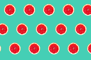Pink grapefruit seamless pattern isolated on mint