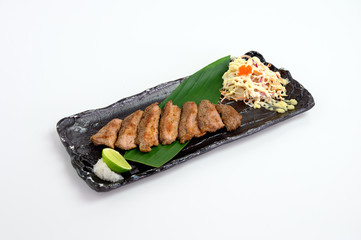 Pork steak with salt and lime seasoning and cabbage salad