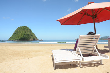 relaxation chair in red island beach, east java, indonesia