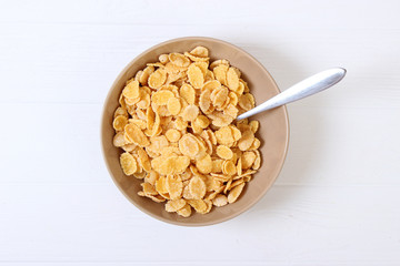dry breakfast in a plate on a colored background top view. cereal