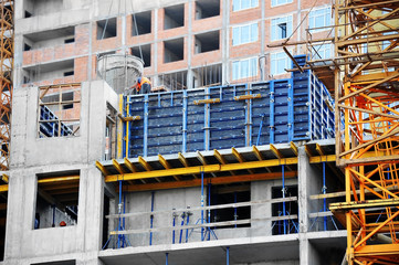 Crane and highrise construction site