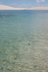 paradise water oasis lake in desert with sand dunes Lençois Maranhenses 
