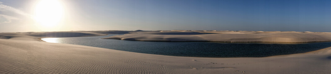 Fototapeta na wymiar Lençois Maranhenses oasis lake in desert with sand dunes panoramic view