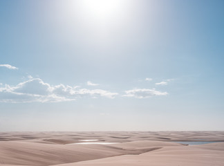 Lençois Maranhenses oasis lake in desert with sand dunes afternoon pastel colors