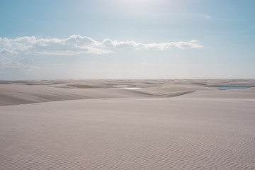 Fototapeta na wymiar Lençois Maranhenses oasis lake in desert with sand dunes sunset afternoon