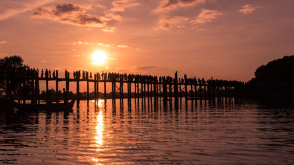 Fototapeta na wymiar People walking on Bridge U-Bein at sunset scene