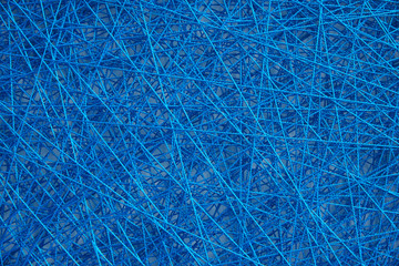 Abstract weave from a thin cord of blue color. Background