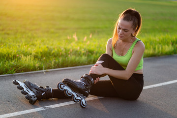 Woman injured knee while rollerblading. A teenager having a bruise after falling while inline...