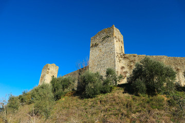 Fototapeta na wymiar Beautiful majestic monteriggioni castle towers against bright blue winter sky, Tuscany, Italy
