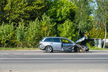 A broken car on the road of Ukraine. Great damage.